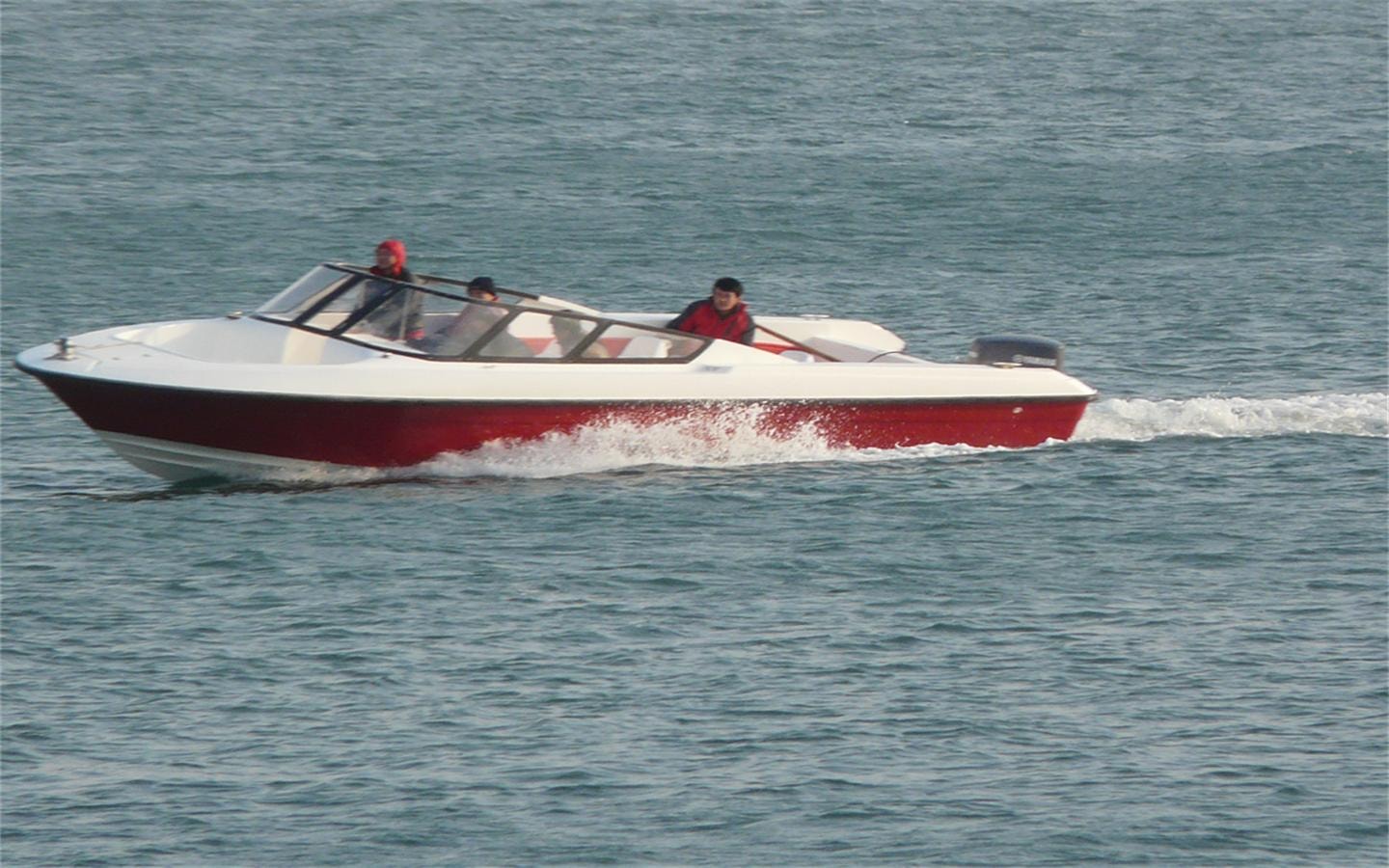 HD-880B fast passenger boat underway at speed on open water