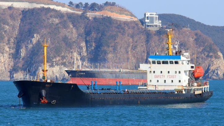 WAN-CARGO-008 cargo ship with yellow cranes at coastal port