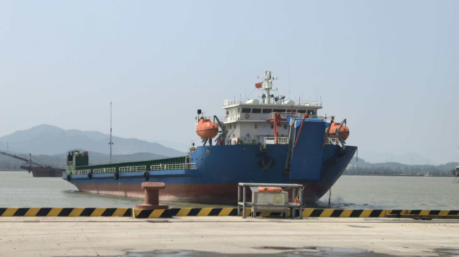 WAN-LCT-009 blue landing craft docked at port