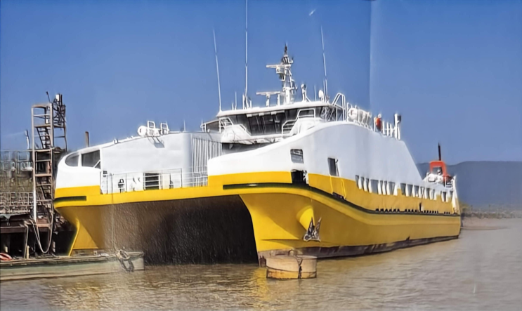 WAN-PAX-006 catamaran car and passenger ferry — yellow and white hull at berth